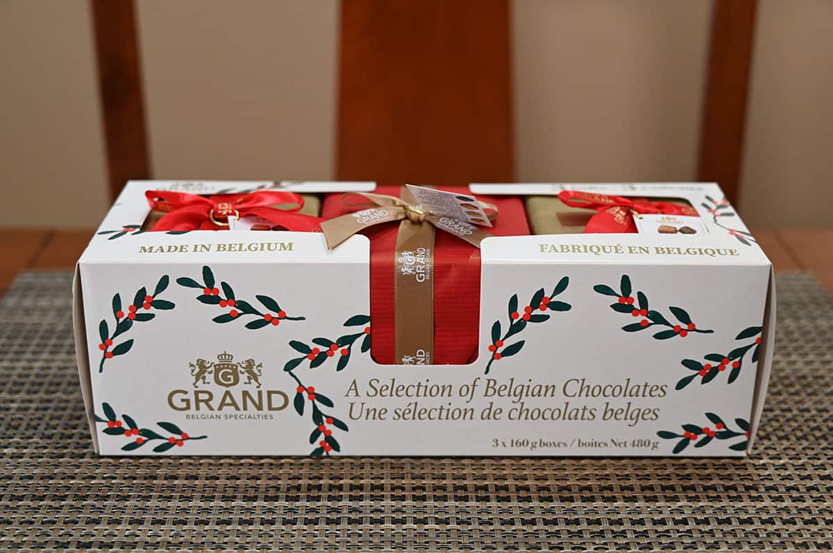 Image of the package of three Grand Belgian Specialties chocolate boxes sitting on a table.
