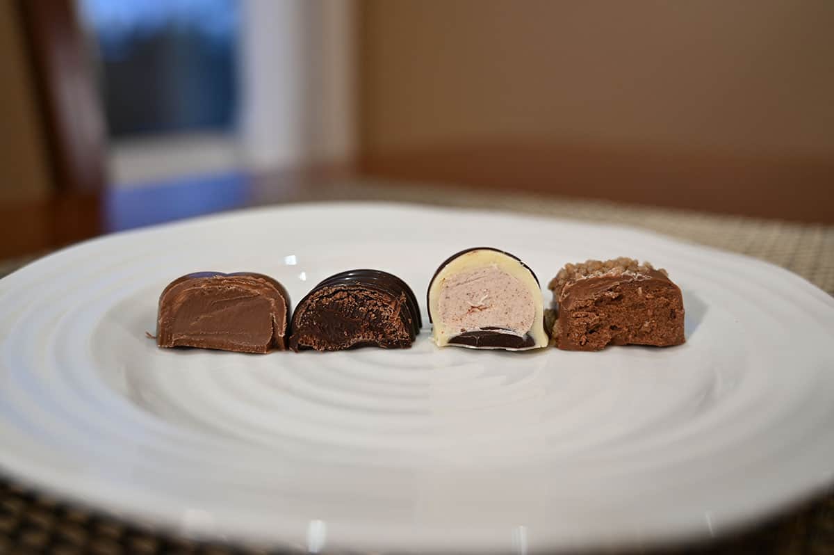 Closeup image of the four different kinds of chocolates cut in half and served on a plate so you can see the center of each chocolate.