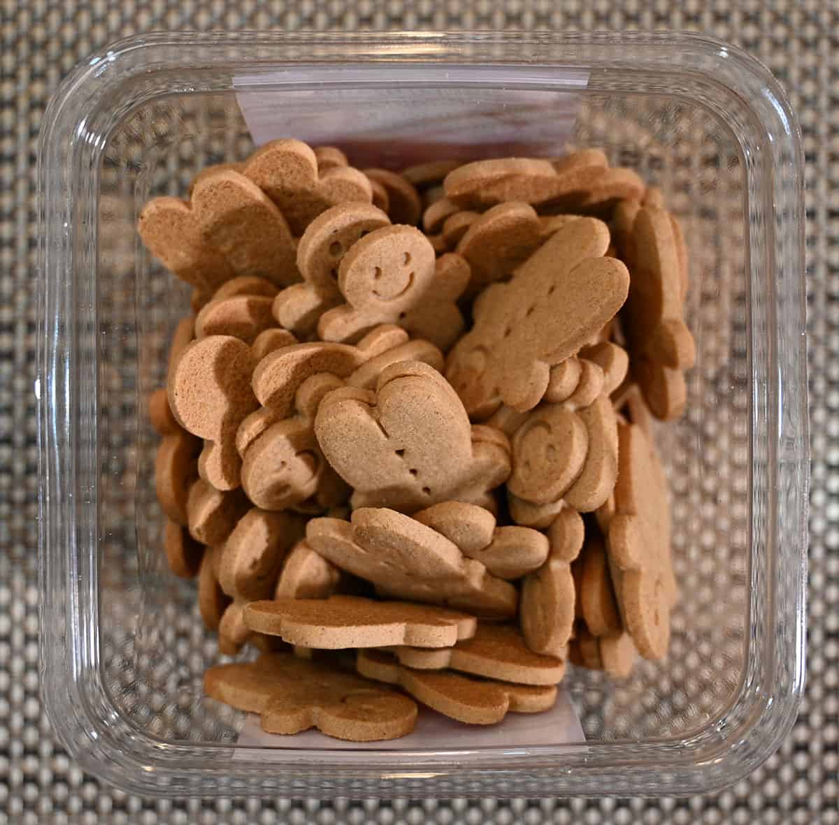 Top down image of the open container of gingerbread cookies.