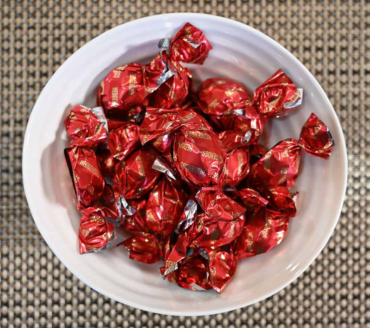 Top down image of a bowl of wrapped chocolates.