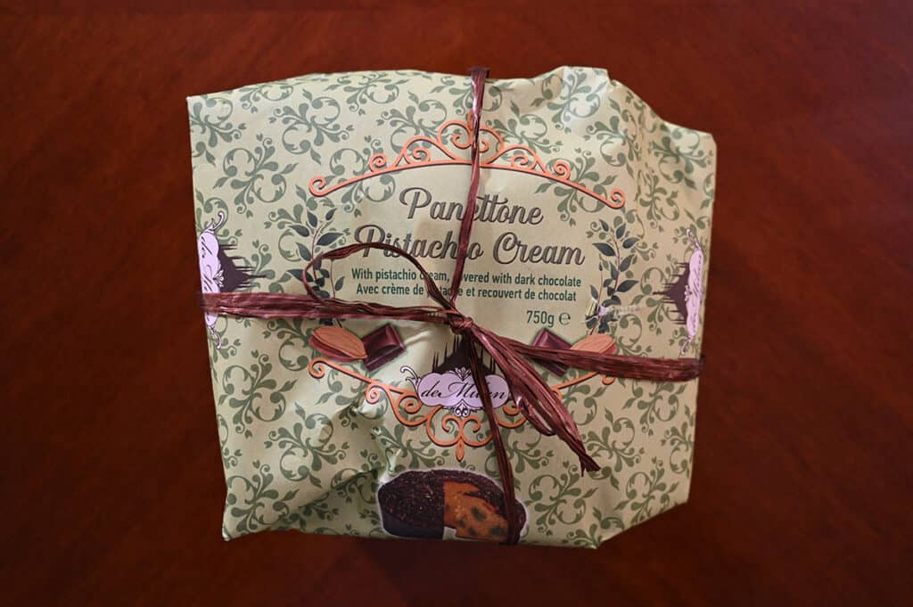 Image of the Costco panettone sitting on a table in  the packaging.