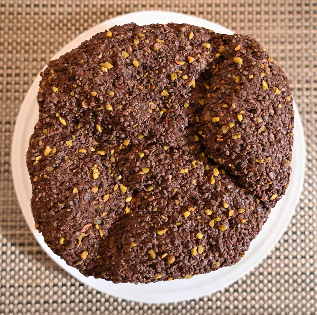 Top down image of the top of the panettone showing the chocolate and pistachios on the top and outside.