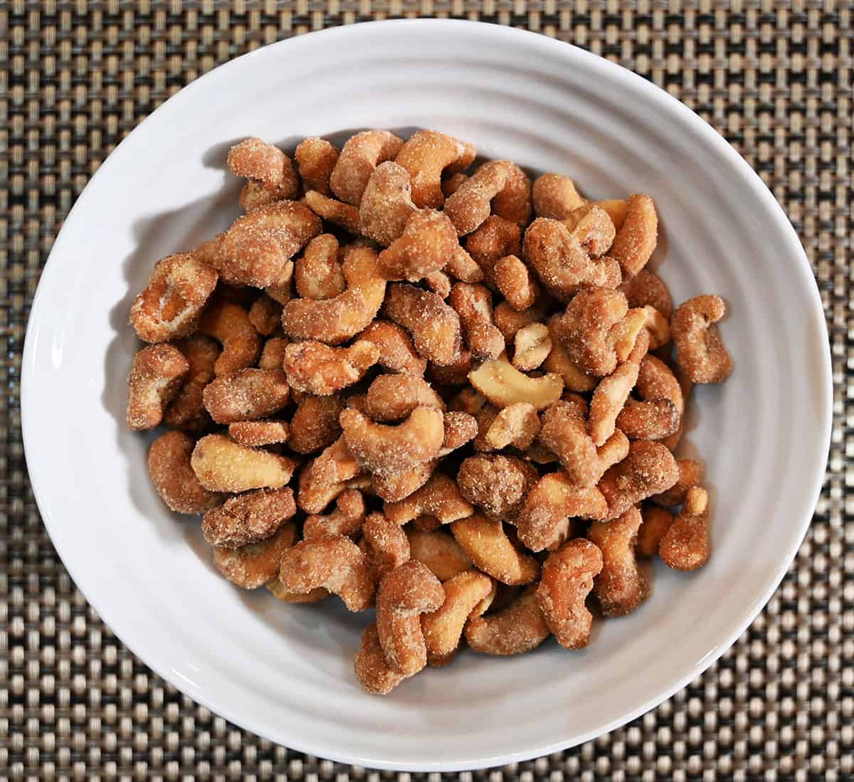 Top down image of a bowl full of cashews.
