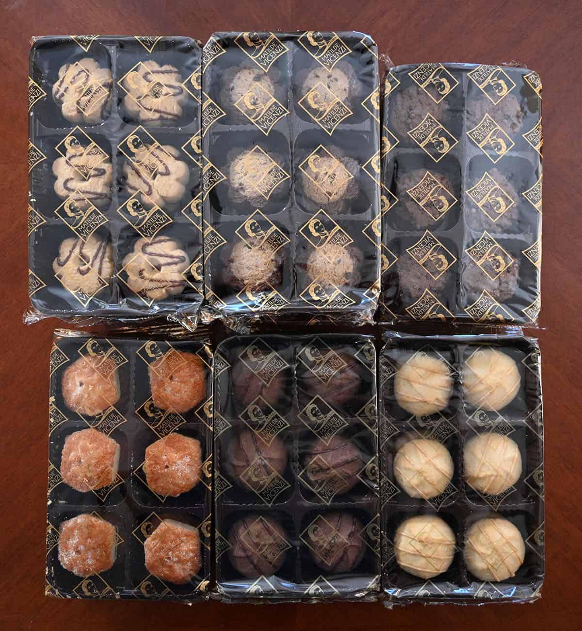 Image showing the six different kinds of cookies in their own plastic tray with plastic packaging.