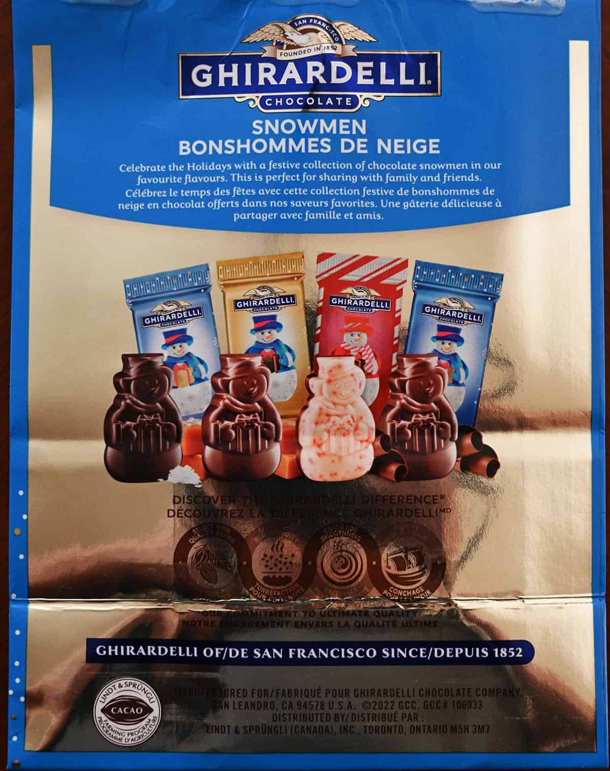 Closeup image of the back of the bag of chocolate snowmen showing the Ghirardelli product description.