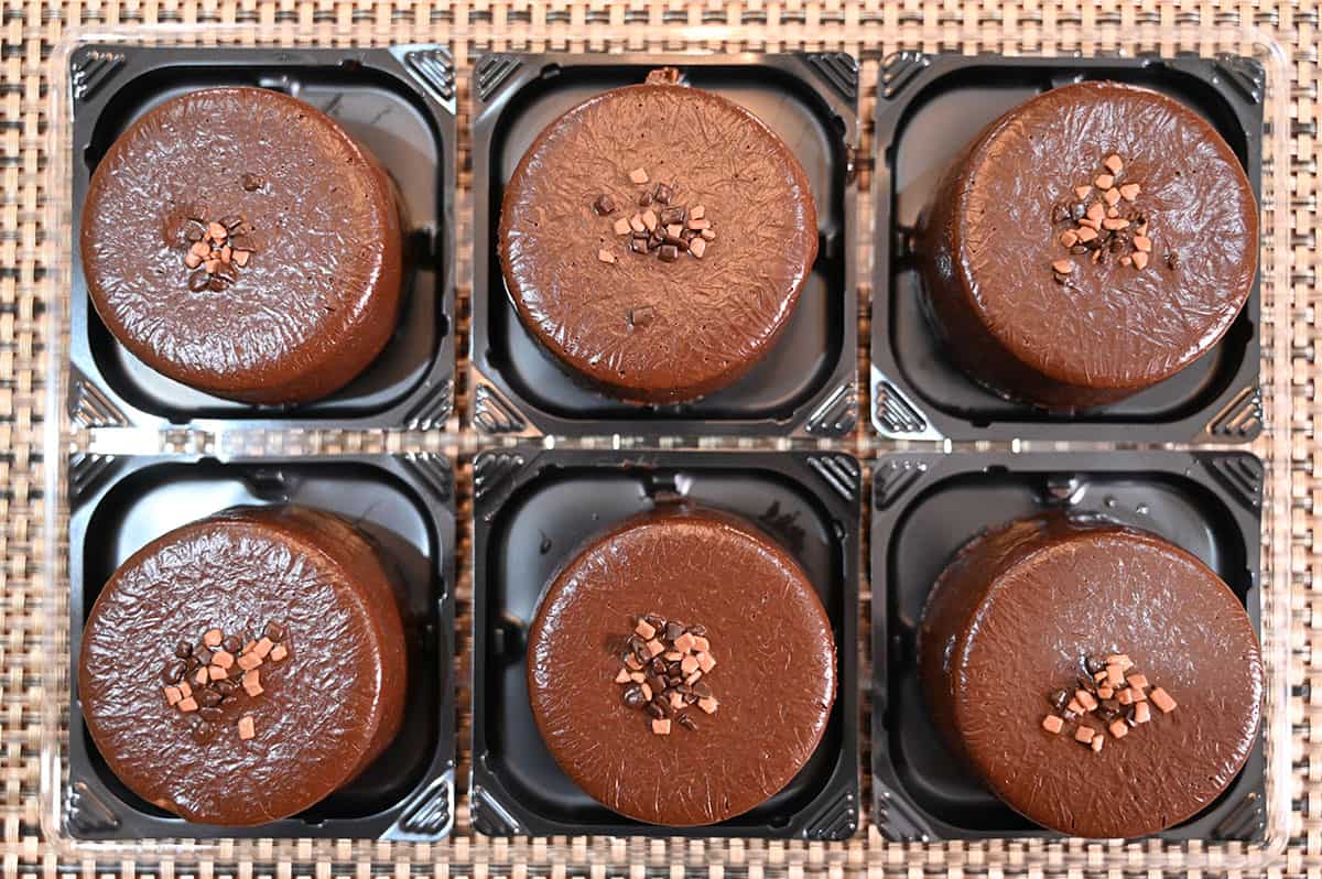 Top down image of the six chocolate mousses that come in the package with the package lid off.