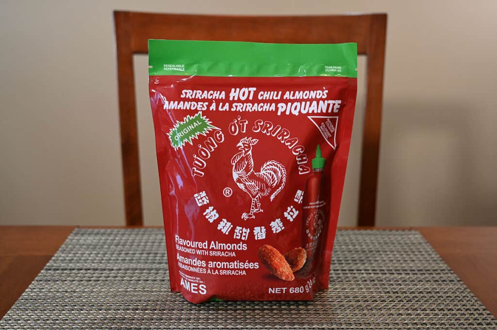 Image of the Costco Sriracha Hot Chili Almonds bag sitting on a table.