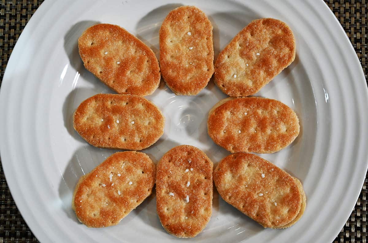 Top down image of eight pastries served on a white plate.