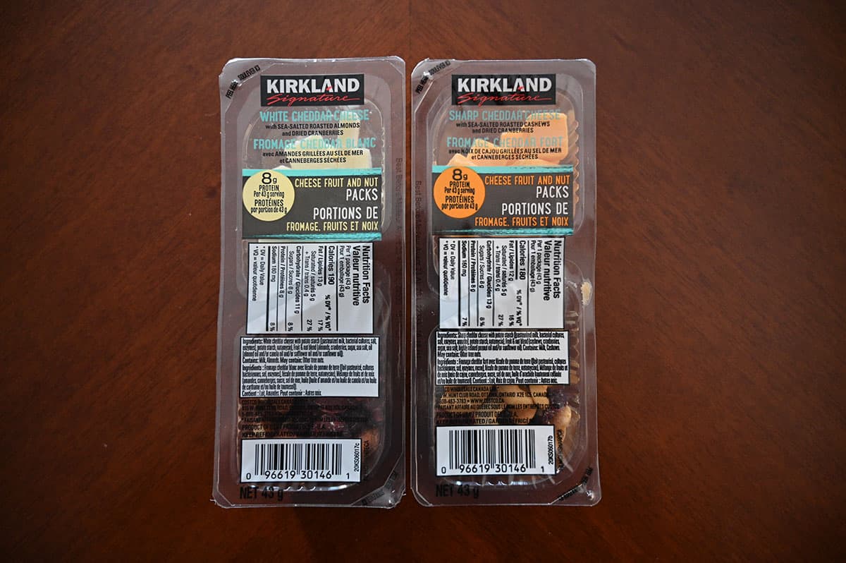 Top down image of the two different packs of Costco Kirkland Signature Cheese, Fruit and Nut Packs unopened.