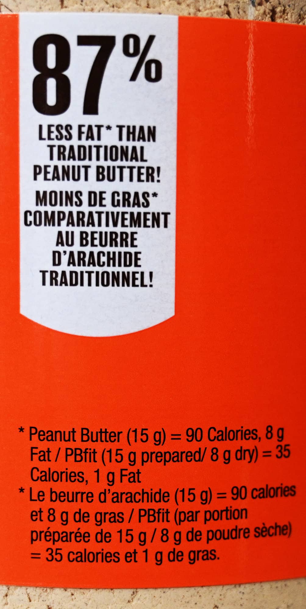 Image showing the container saying there is less fat than traditional peanut butter.