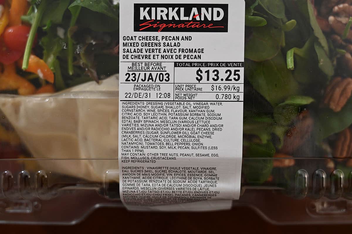 Closeup image of the front label on the salad container stating the price, ingredients and best before date.