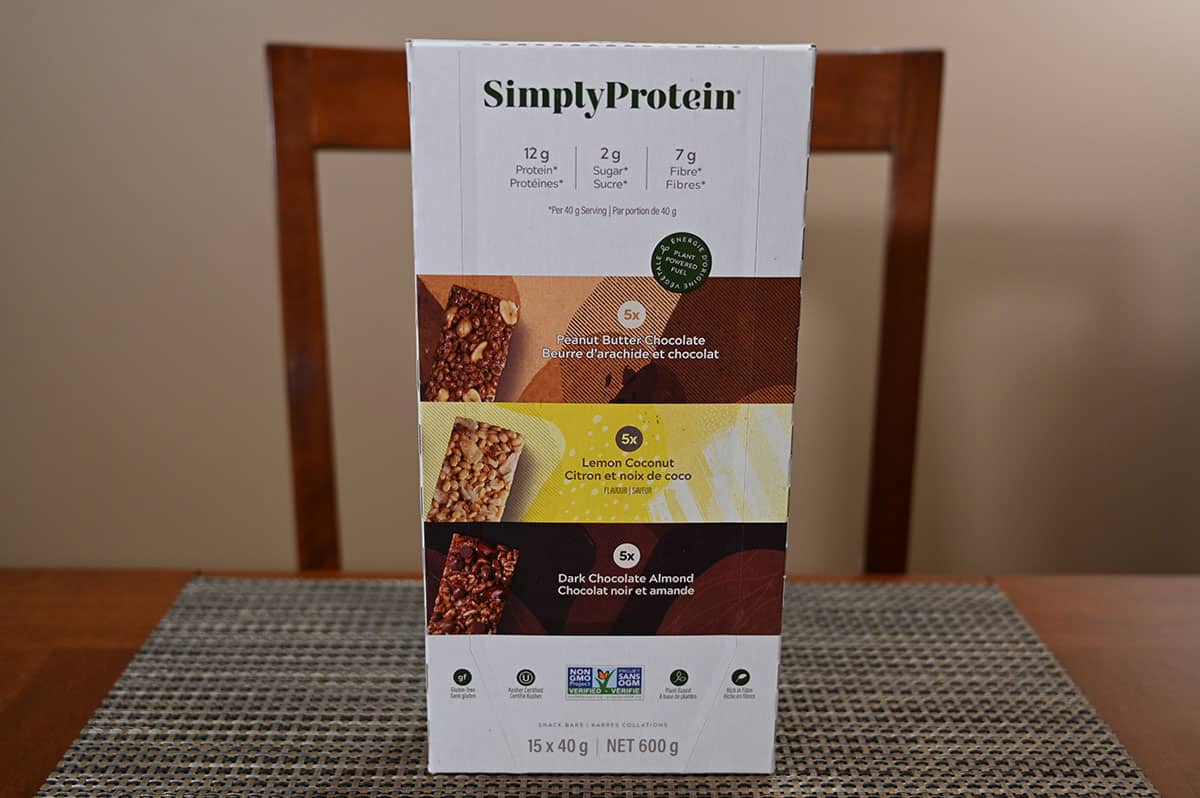 Image of the Costco Simply Protein bars box sitting on a table.