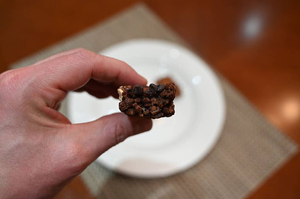 Image of the dark chocolate almond bar, unwrapped with a bite taken out of it.
