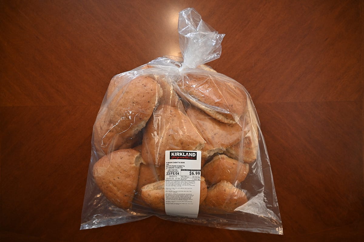 Image of a bag of the Costco 9 Grain Ciabatta Buns sitting on a table.