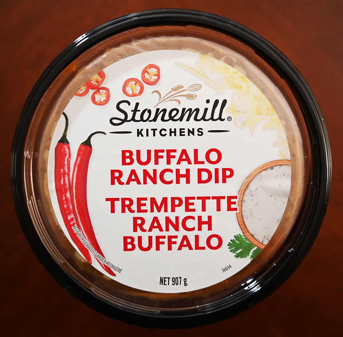 Closeup top down image of the top of the buffalo ranch dip container showing the product weight and name