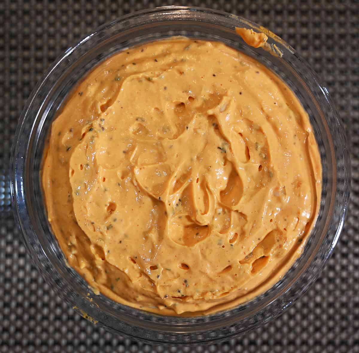Top down image of the container of dip open so you can see what the dip looks like.