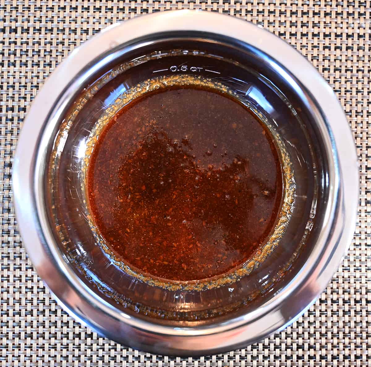 Top down image of a bowl with the marinade poured into it.