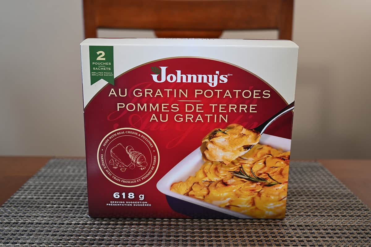 Image of the Costco Johnny's Au Gratin Potatoes box sitting on a table.