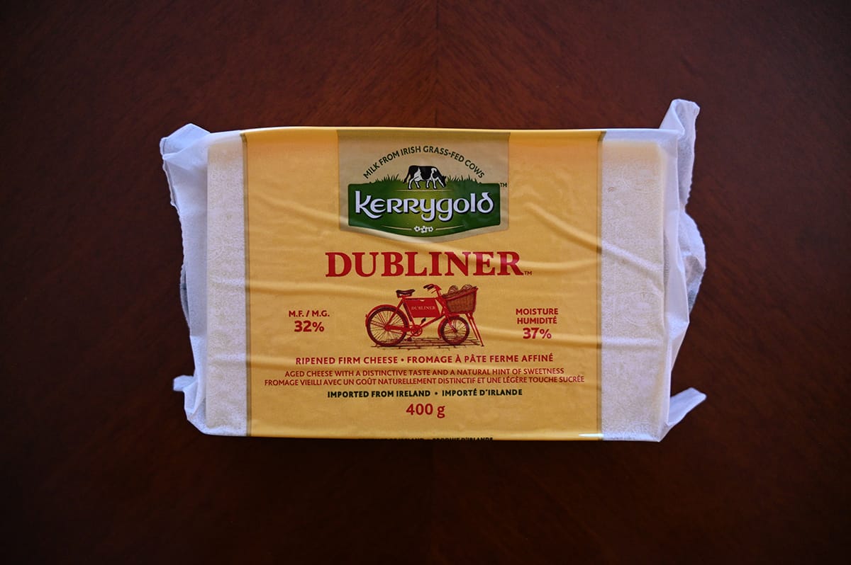 Image of a block of Costco Kerrygold Dubliner Cheese sitting on a table.