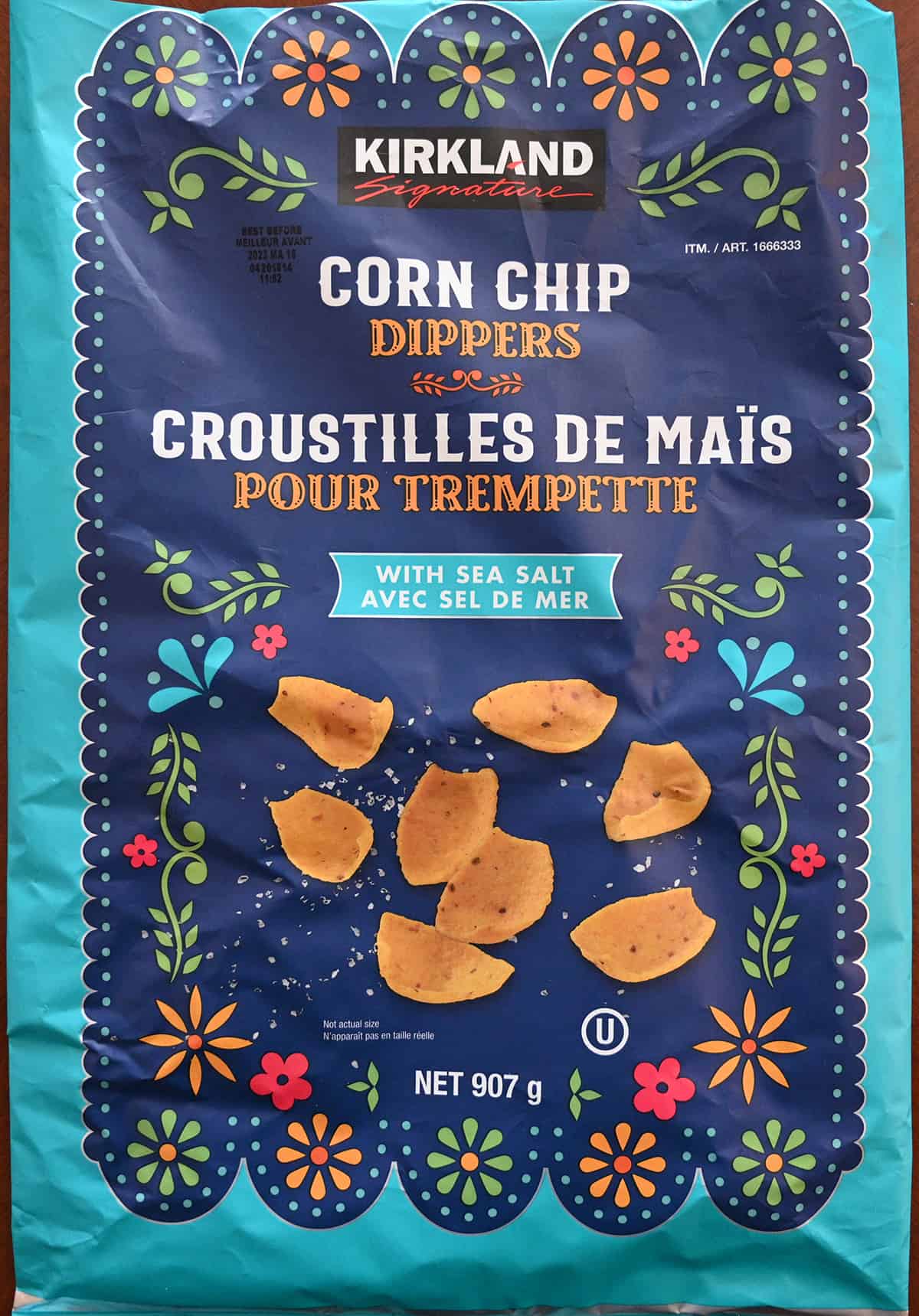 Closeup image of the corn chip dippers front of the bag showing the size of the bag and that they have sea salt.