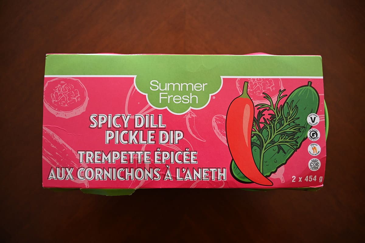 Image of the Costco Summer Fresh Spicy Dill Pickle Dip sitting on a table in the packaging. 