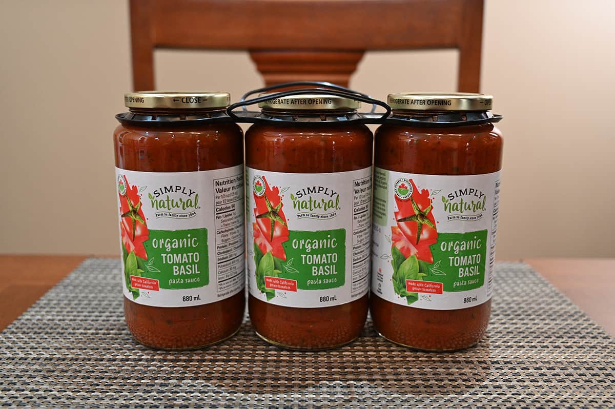 Image of the three-pack of tomato sauce jars sitting on a table.