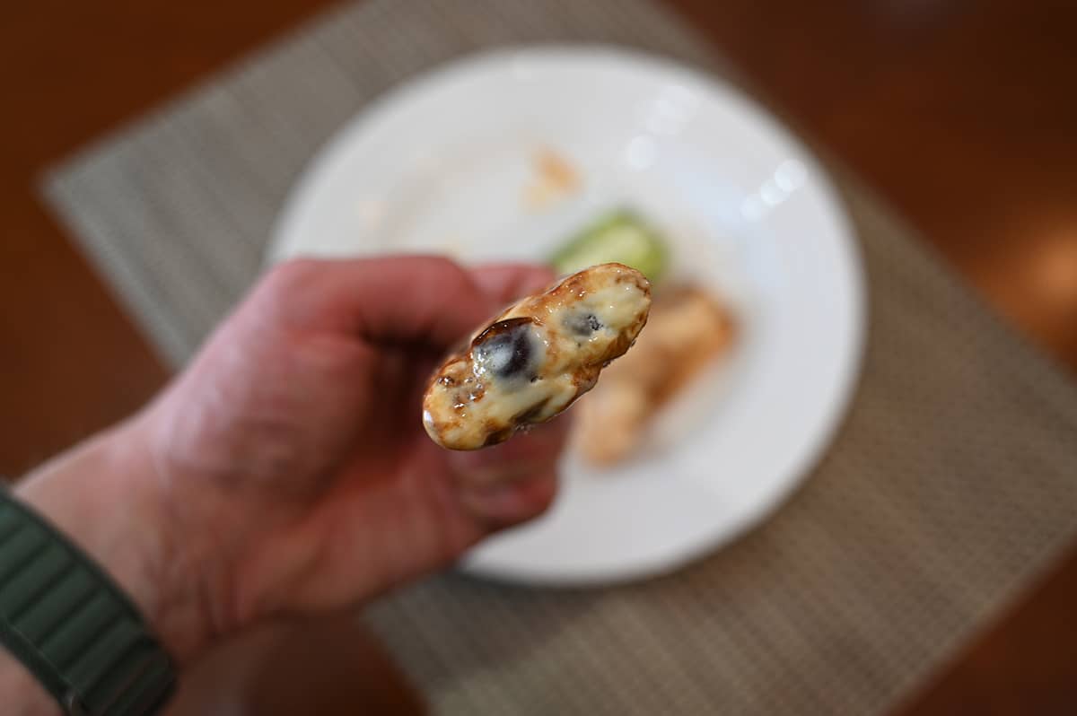 Image of a brown sugar boba bar with a bite taken out so you can see the tapioca balls inside.