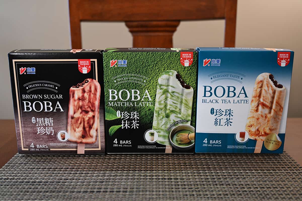 Image of the three smaller boxes that contain each flavor sitting on a table.