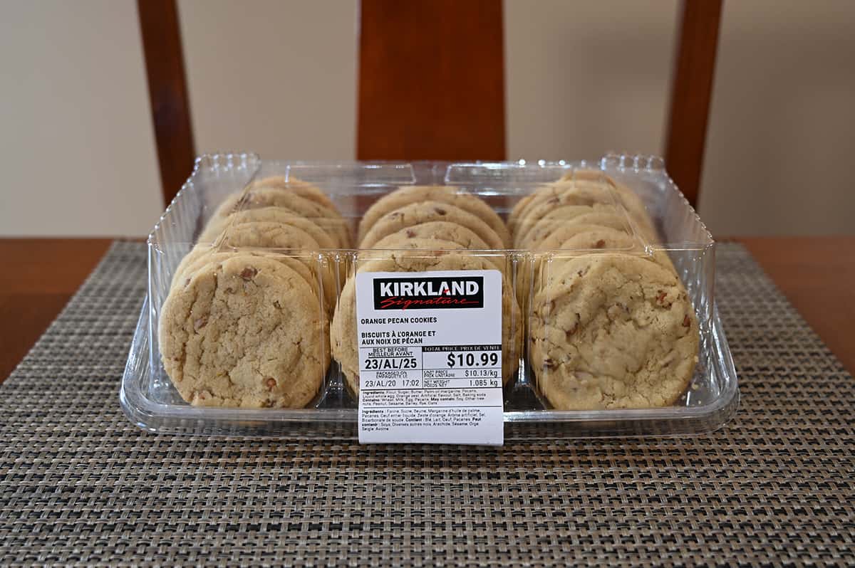 Image of the Costco Kirkland Signature Orange Pecan Cookies container sitting on a table.