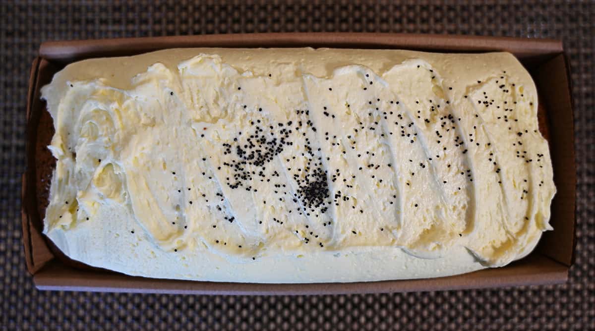 Top down image of the lemon poppyseed loaf showing the icing with a sprinkle of poppyseeds on top.