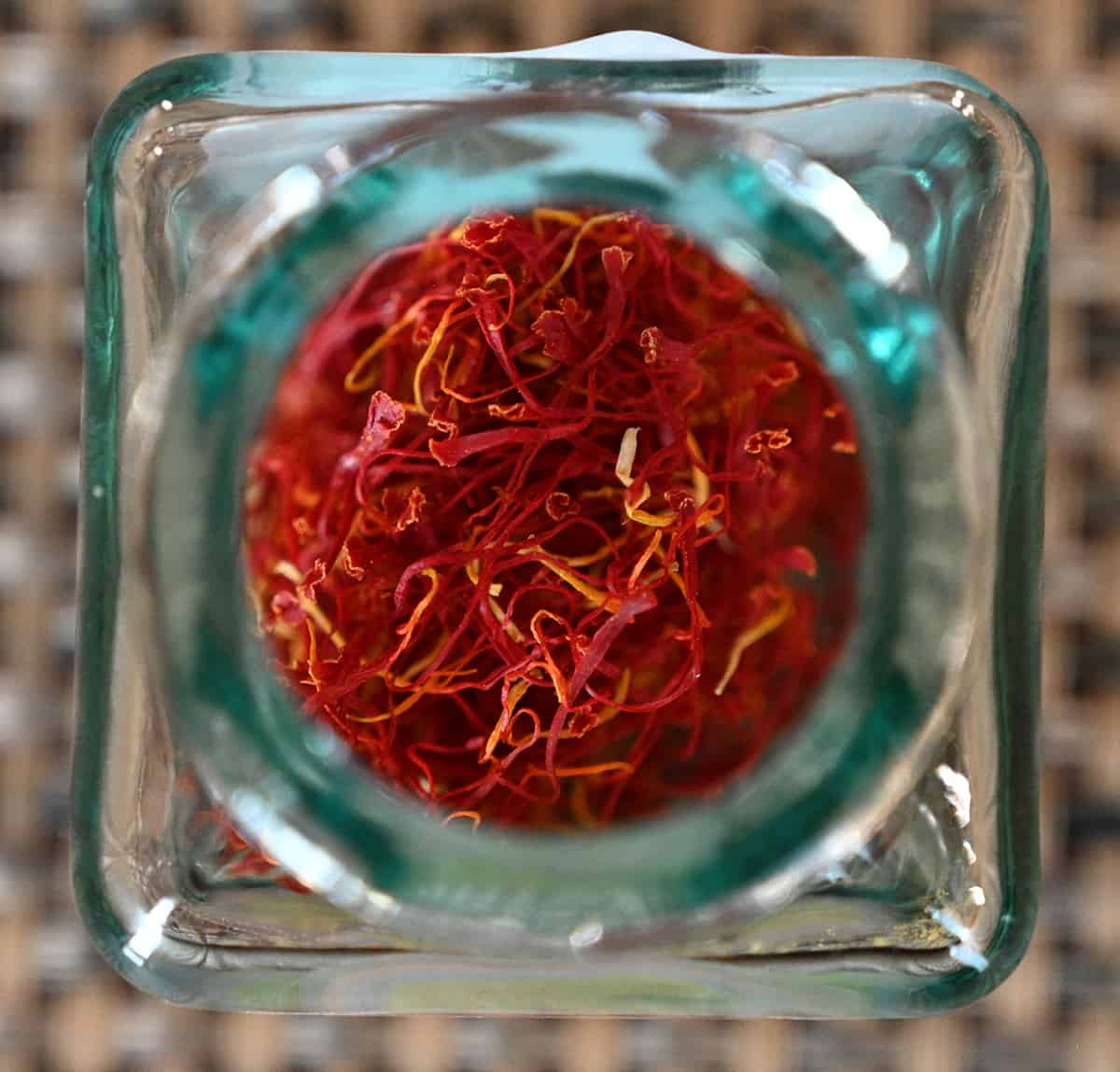 Closeup top down image of the saffron jar open so you can see the threads in the jar.