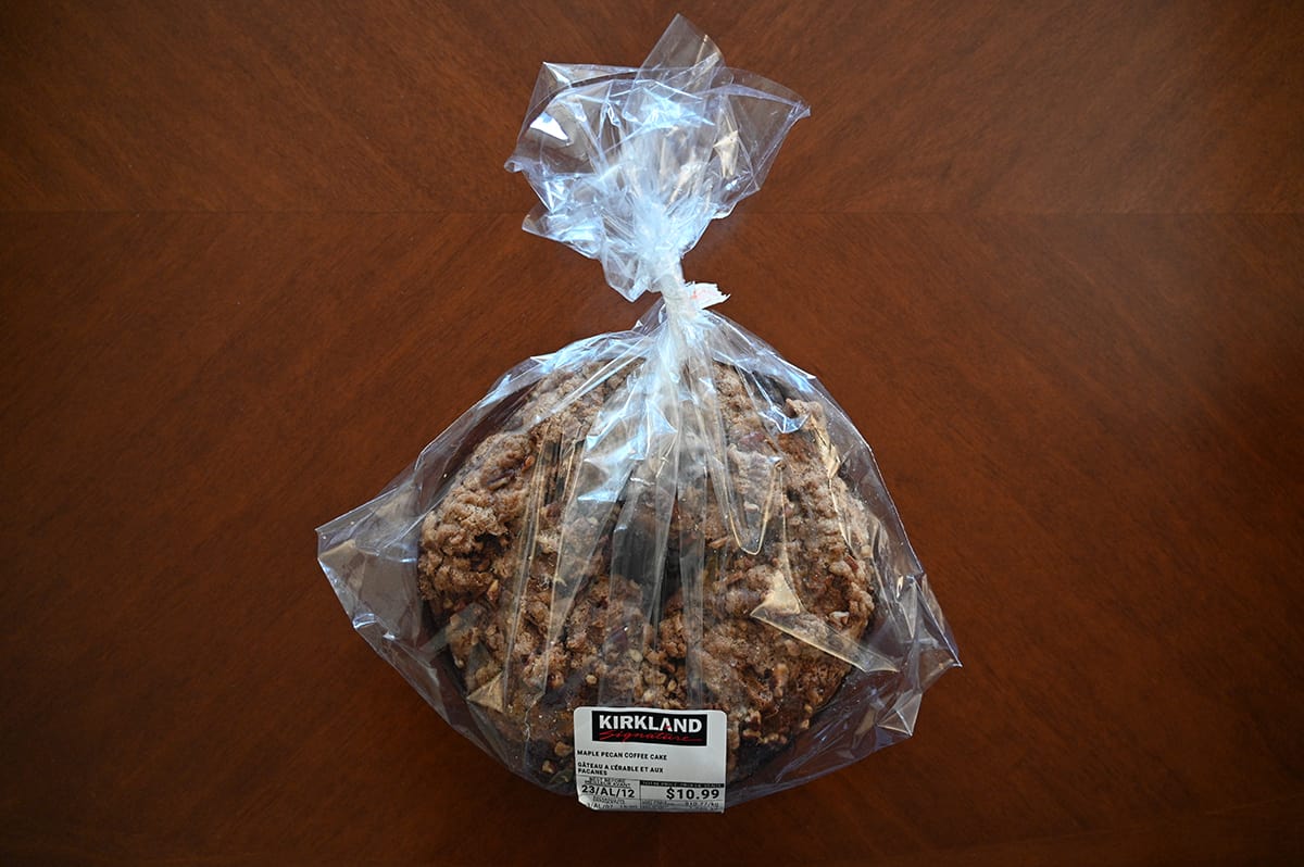 Image of the Costco Kirkland Signature Maple Pecan Coffee Cake in the packaging on a table.