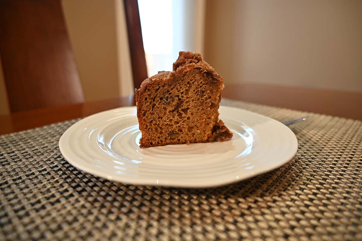 Image of one slice of coffee cake cut and served on a white plate so you can see the inside of the cake.