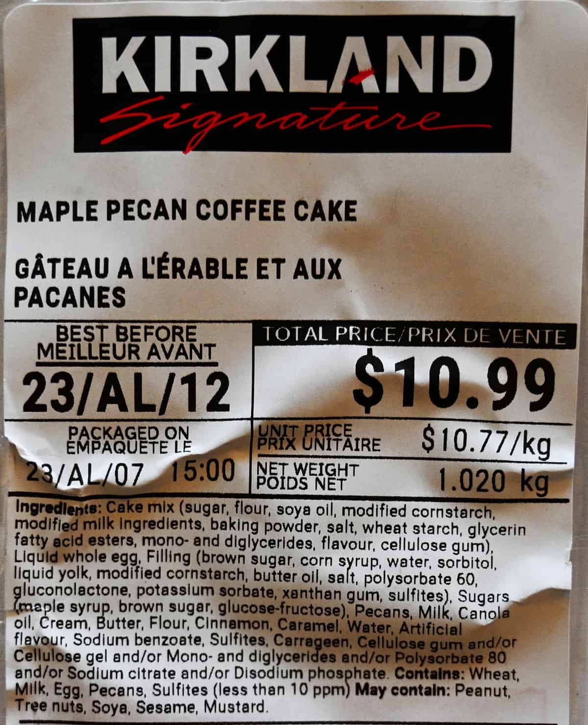 Closeup image of the label on the coffee cake showing the cost and best before date.