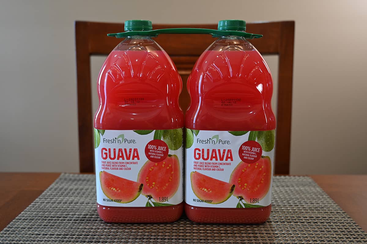 Image of Costco Fresh n' Pure Guava Juice two pack of 1.89 liter bottles sitting on a table.
