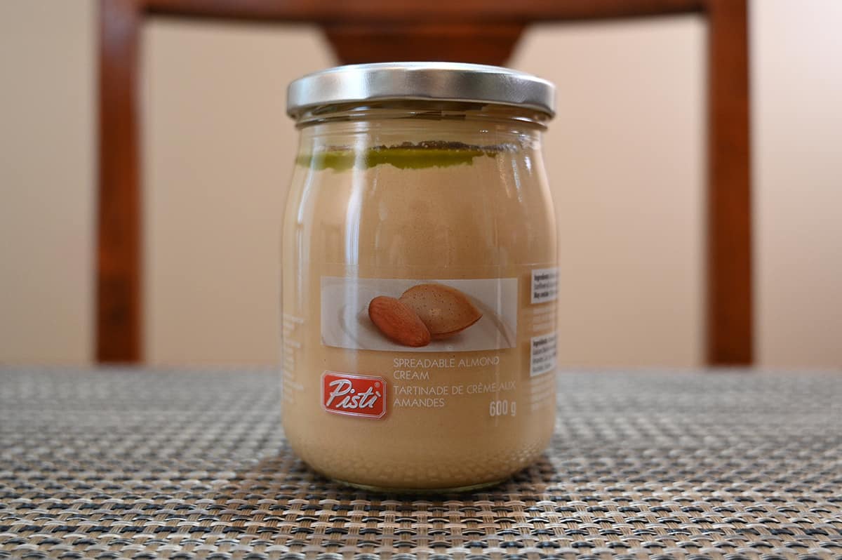 Image of the Costco Pisti Spreadable Almond Cream jar sitting on a table.