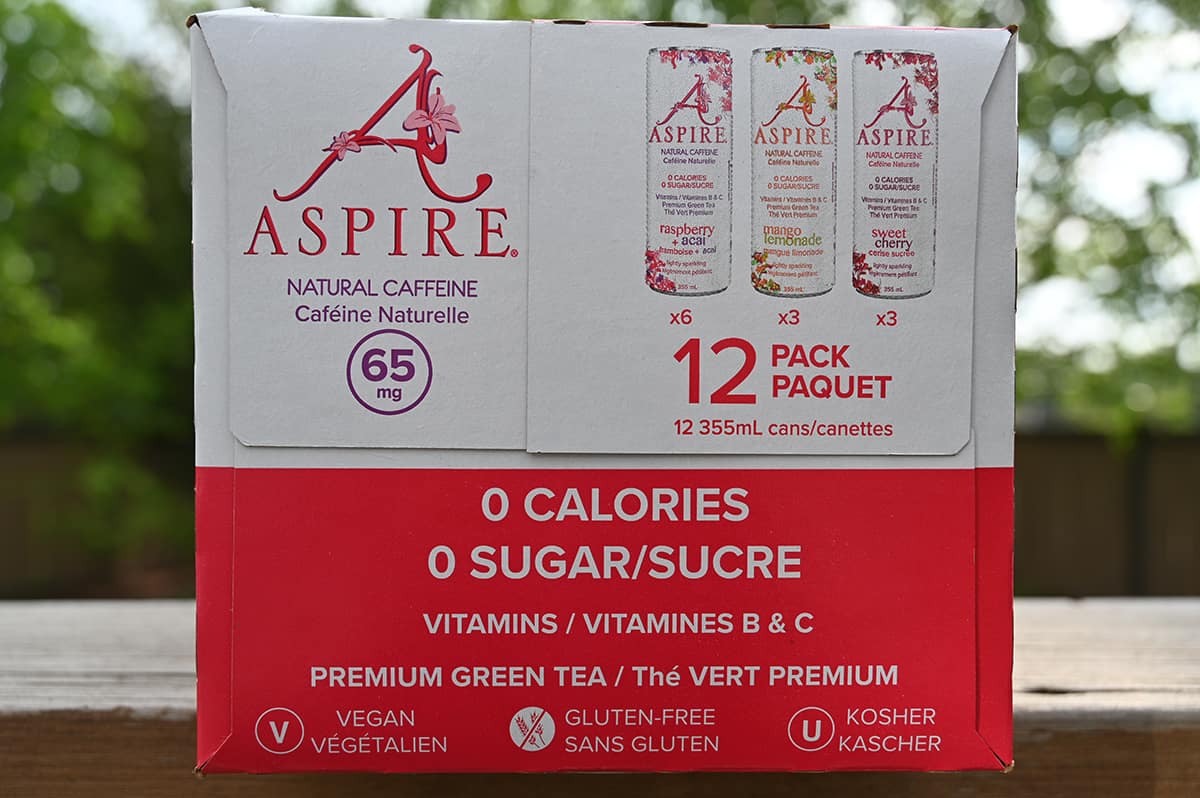 Image of the box of Aspire energy drink case sitting outside, the box says zero calories and premium green tea.