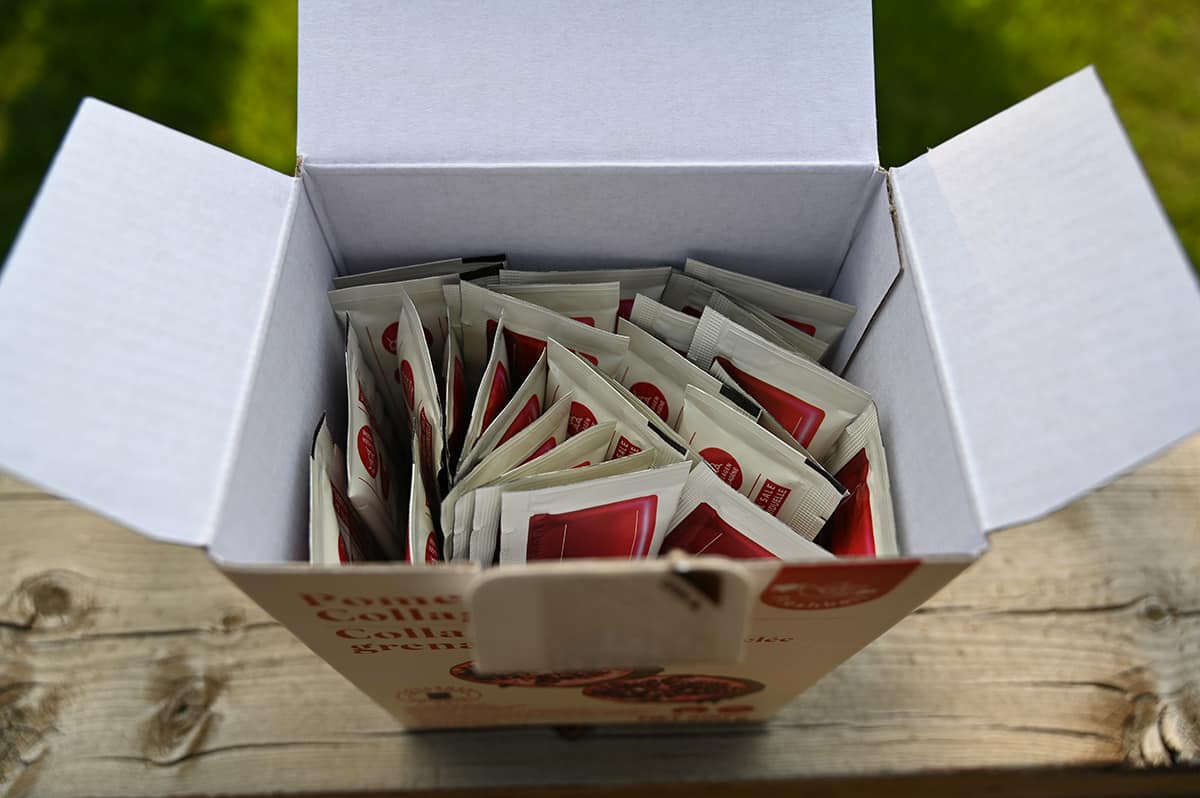 Image of the open box of pomegranate collagen jelly sticks showing the individual packages of jelly sitting in the box.