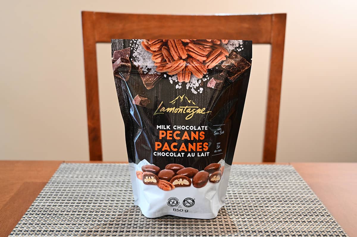 Image of the Costco Lamontagne Milk Chocolate Pecans bag sitting on a table.