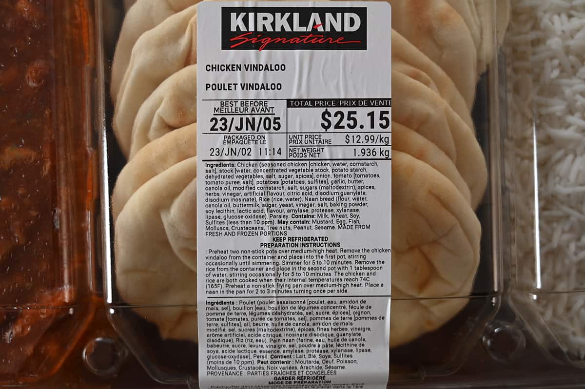 Closeup image of the front label on the vindaloo showing the price, best before date, ingredients and preparation instructions.