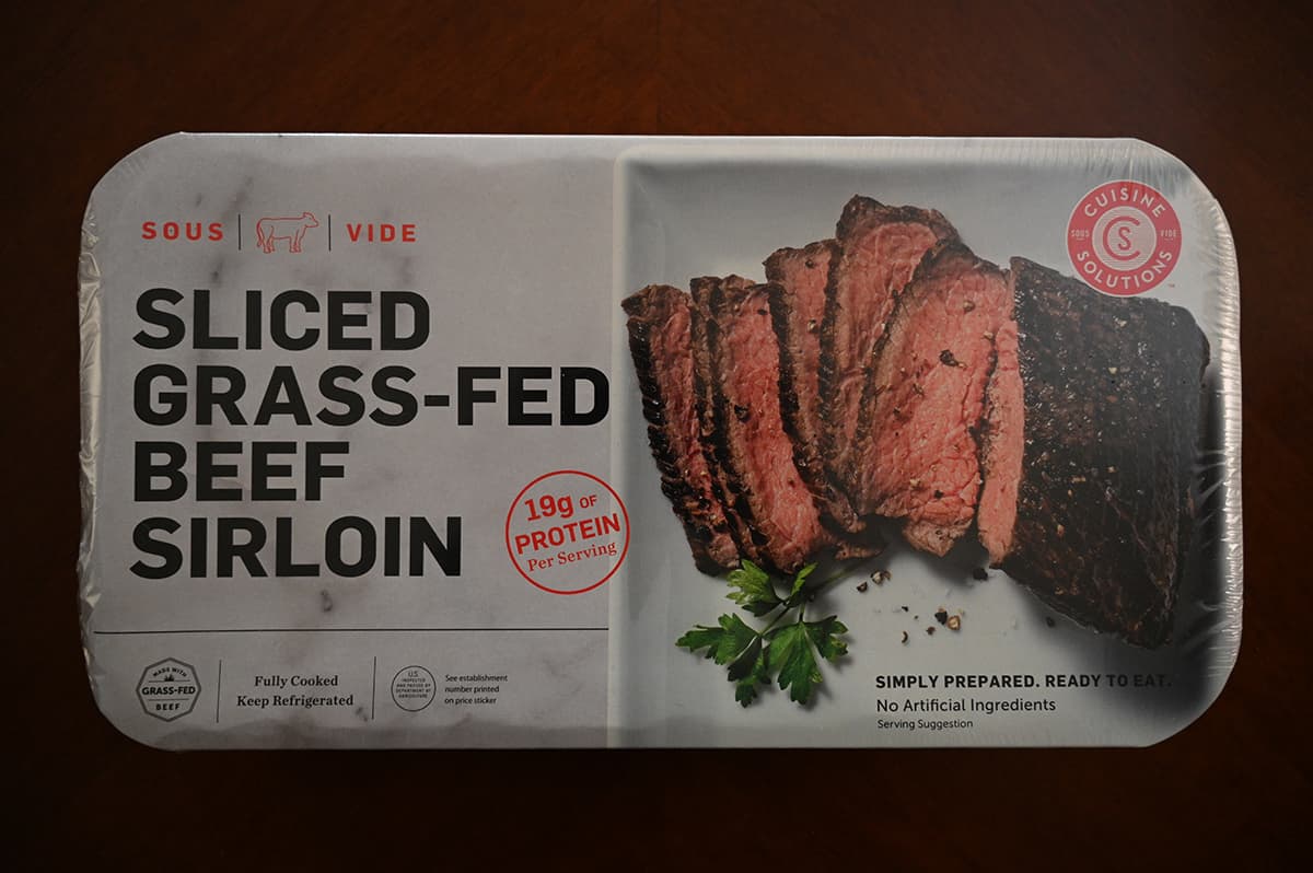 Image of the Costco Cuisine Solutions Sliced Grass-Fed Beef Sirloin package sitting on a table unopened.