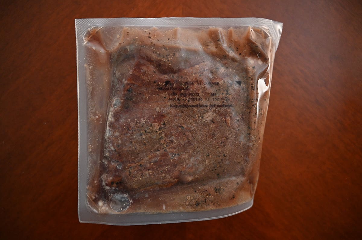 Top down image of one vacuum sealed package of sirloin.