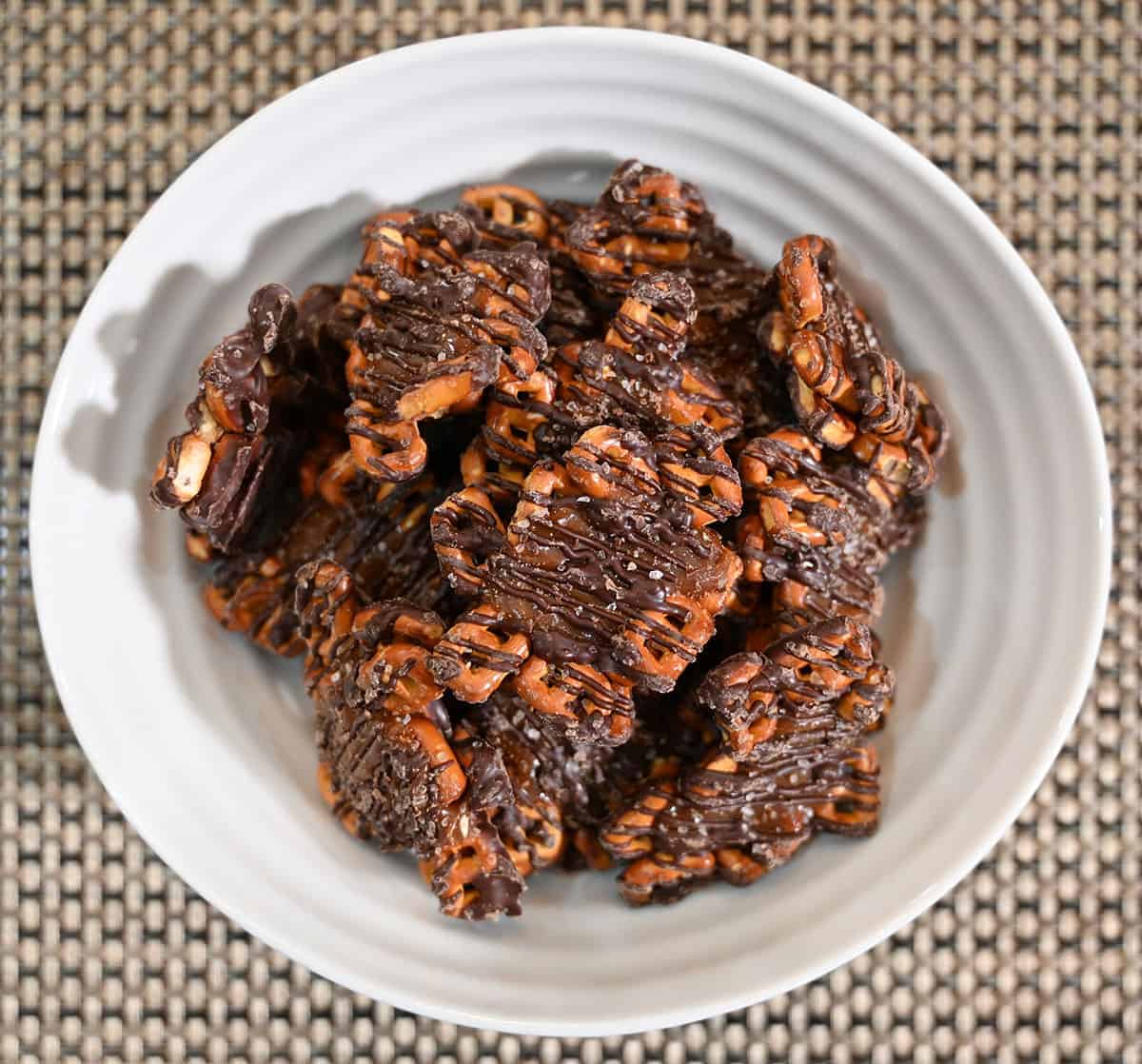 Closeup image of a white bowl full of dark chocolate sea salt Snappers 