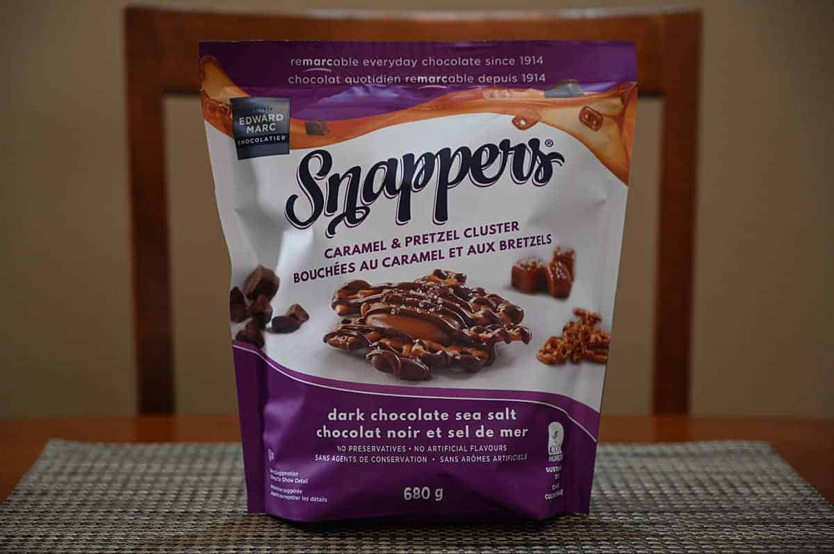 Image of the dark chocolate, sea salt, caramel & pretzel Snappers bag sitting on a table.