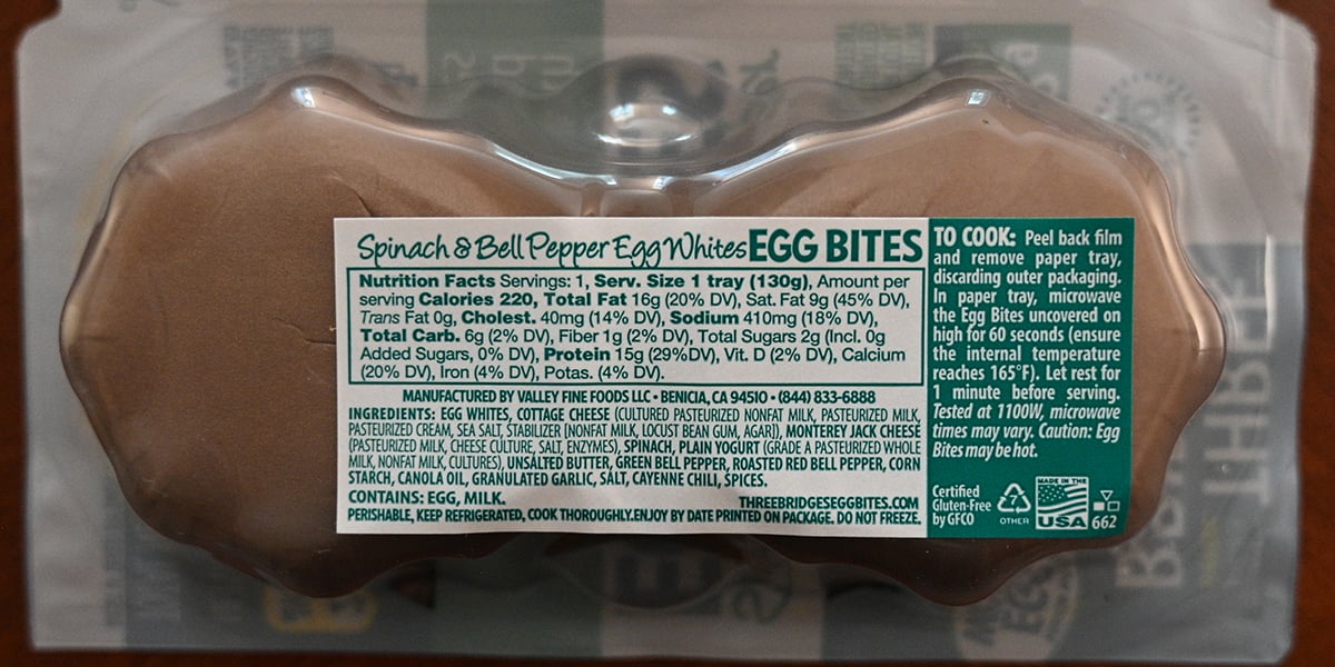 Image of the back label of the spinach & bell pepper egg bites showing calories, ingredients and how to cook.