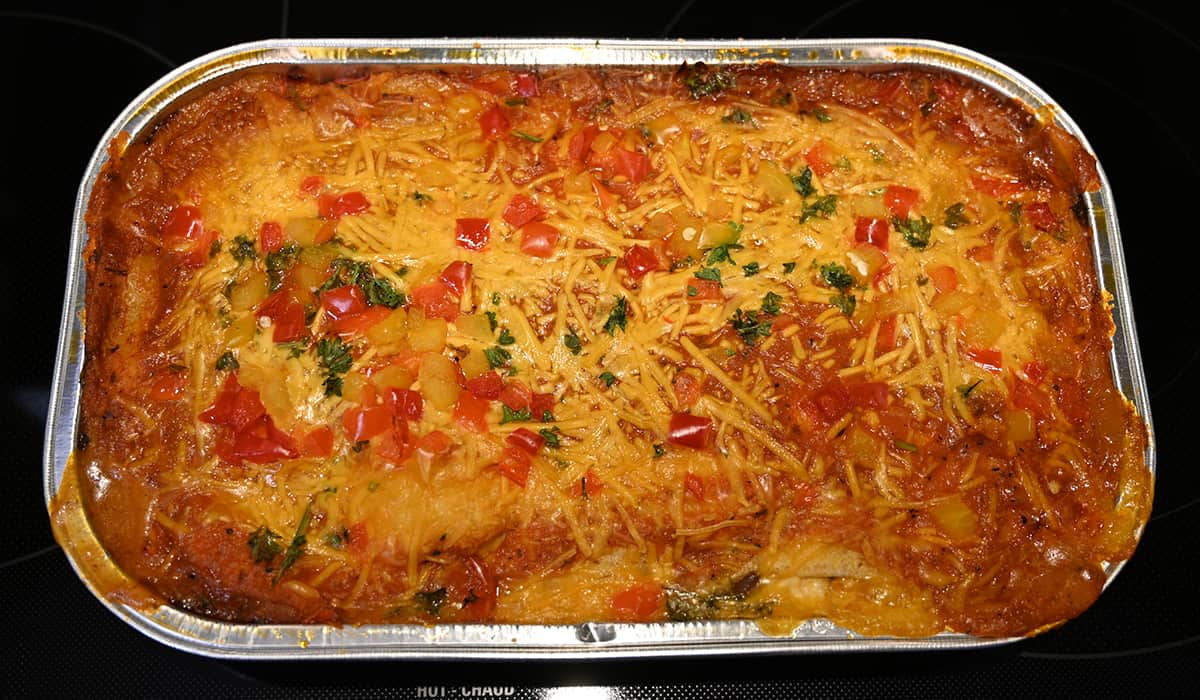 Top down image of the enchilada bake tray uncovered after being baked in the oven showing the cheese melted.