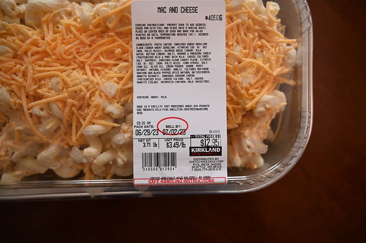 Top down image of the front label on the mac and cheese package showing the best before date, cost and ingredients.