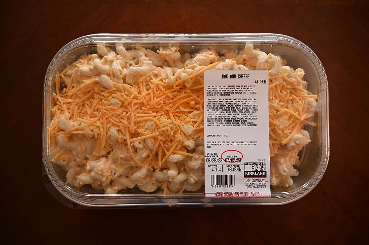 Top down image of the Costco Kirkland Signature Mac and Cheese pre-made meal unopened sitting on a table.
