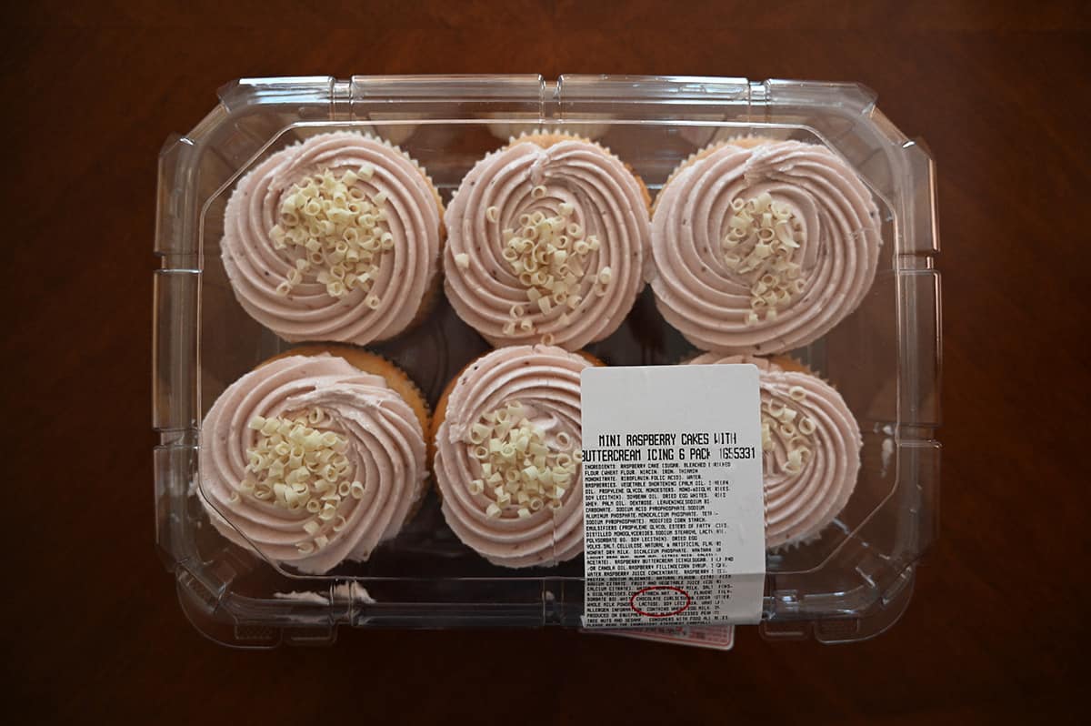 Top down image of the Costco Mini Raspberry Cakes with Buttercream Icing  in their package unopened sitting on a table.