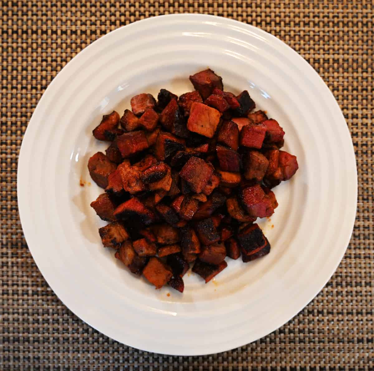 Top down image of a plate full of cooked burnt ends.